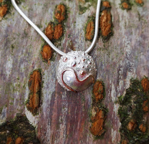 A closer look at the Small Cúrsa an tSaoil Journey of Life Pendant handcrafted from sterling silver by Elena Brennan Jewellery.