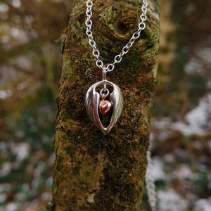 Sterling silver Angel Hug Pendant with angel wings embracing 10ct rose gold heart, its a special gift to show your love!