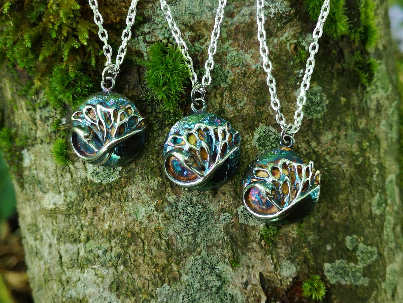 Three bespoke swan pendants by Elena Brennan Jewellery