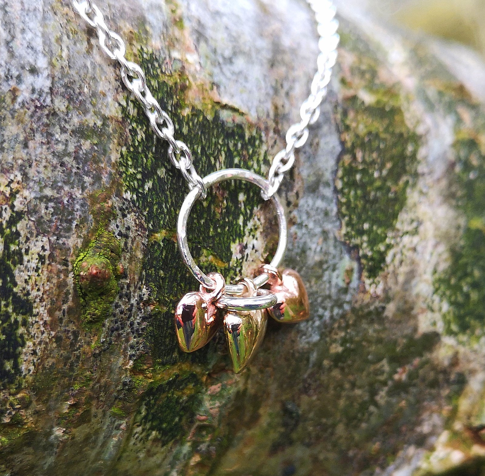 Bespoke three gold heart pendant by Elena Brennan Jewellery