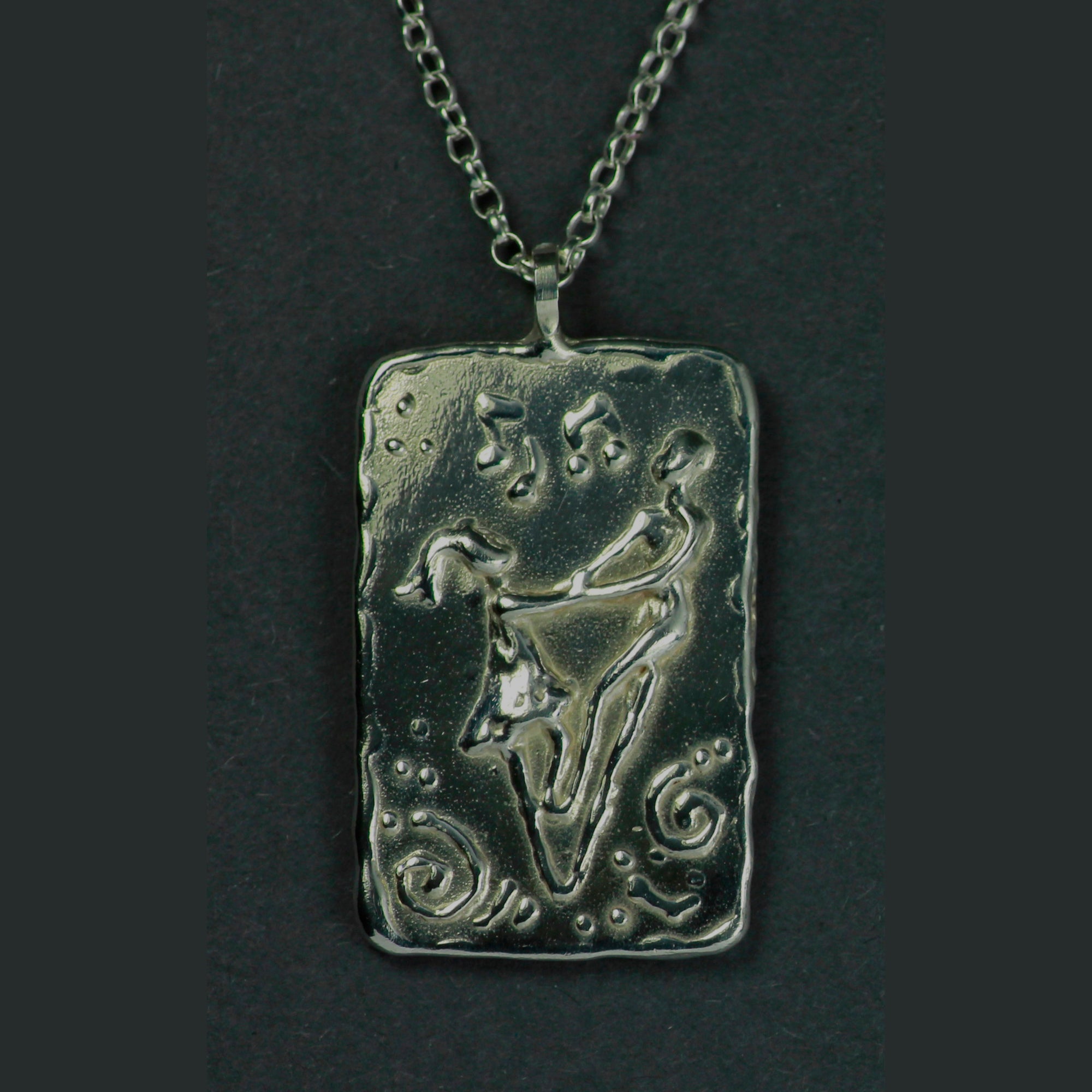 Silver dancing at the crossroads pendant