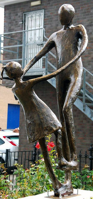 The sculpture titled 'Dance, dance where ever you may be', in Cavan town, designed and created by Tina Quinn for the Cavan Fleadh Cheoil na hÉireann 2010, depicting a man dancing with his daughter.