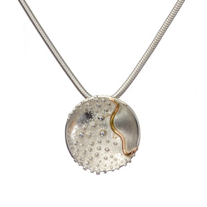 Cúrsa an tSaoil  medium concave pendant with a shiny Silver finish.
