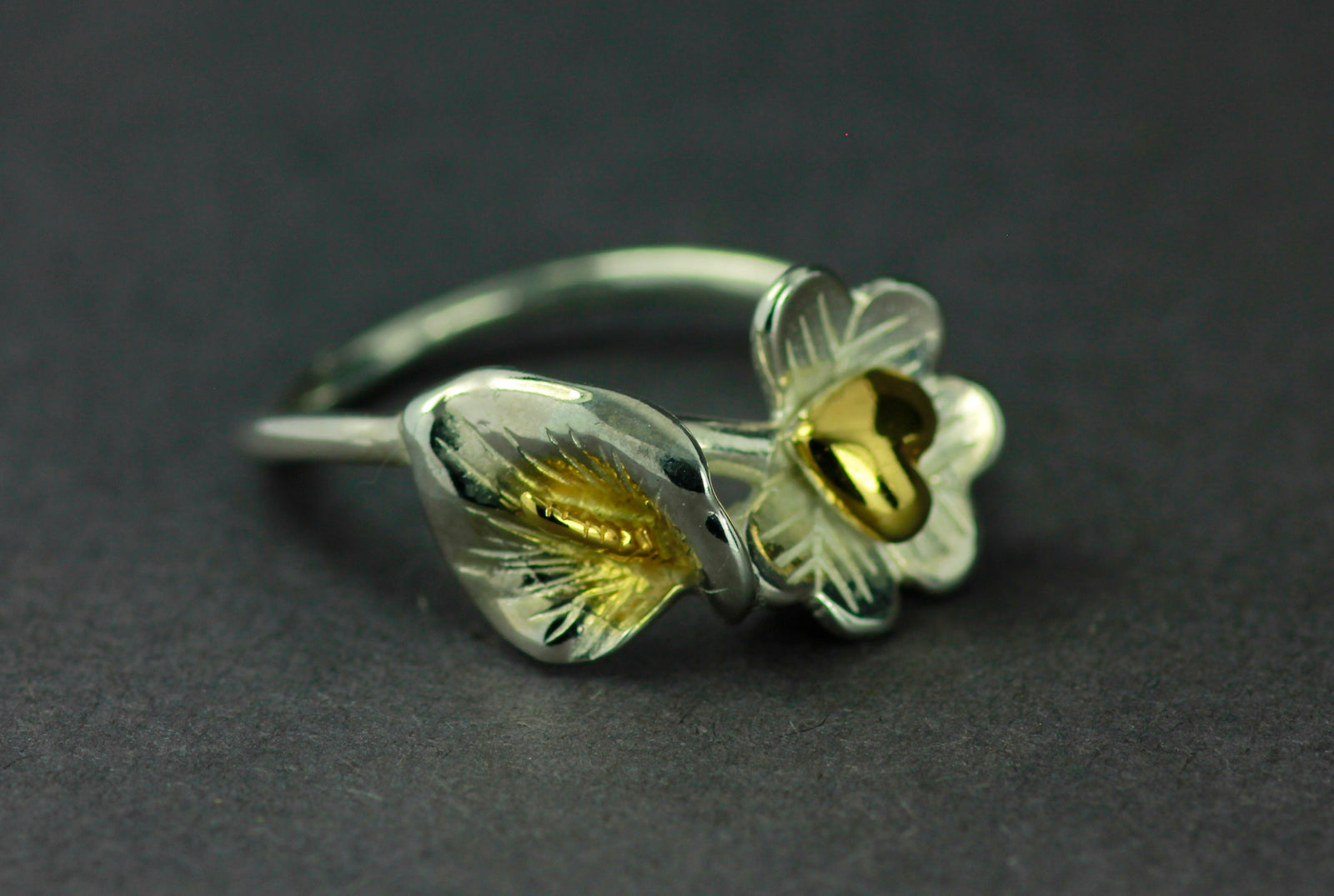 Fire of freedom Irish ring with eart, sharmock and lily.