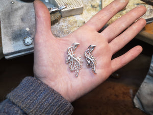 Four headed Children of Lir pendants made of sterling silver.