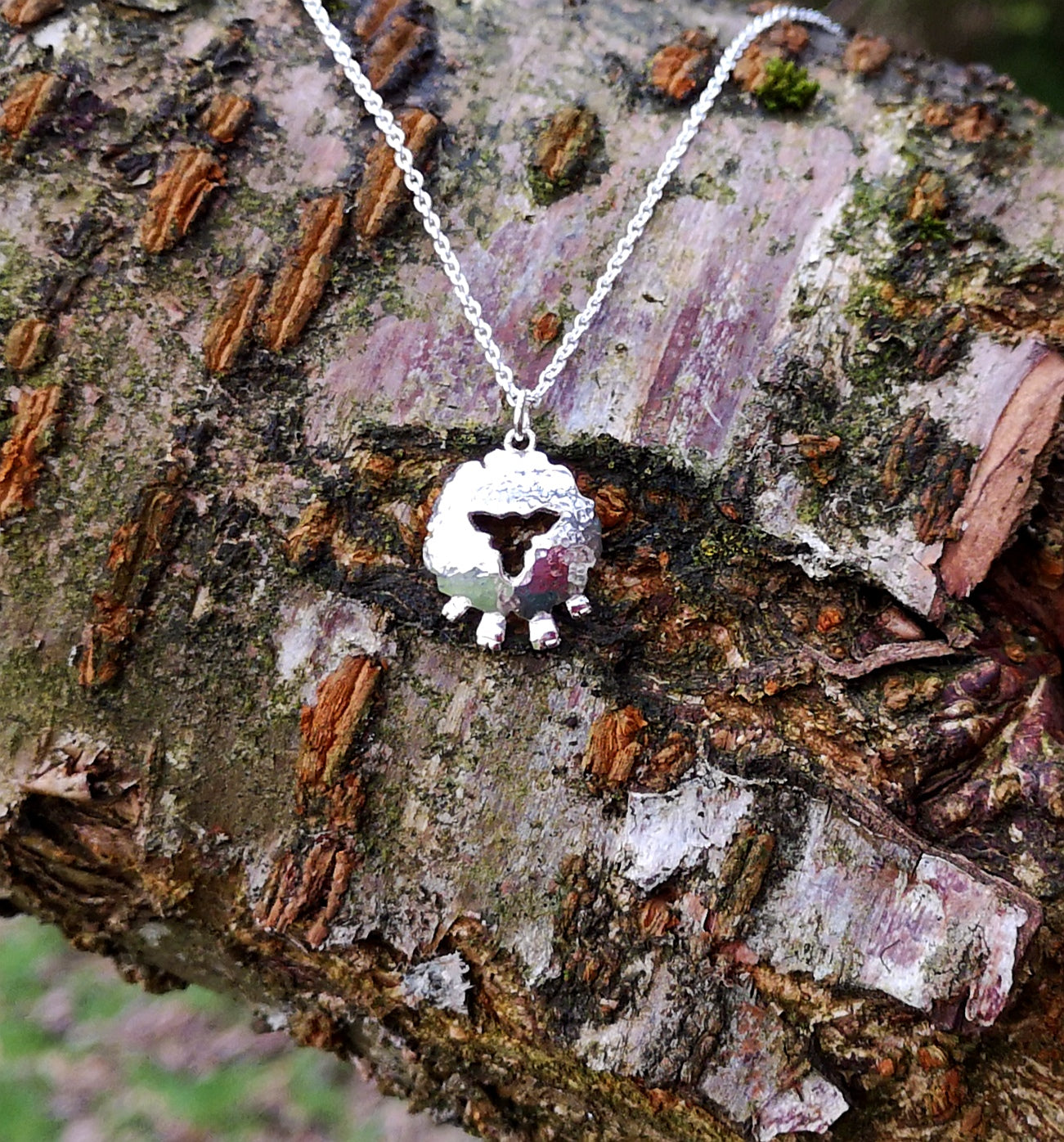 Sassy front-facing sheep pendant made of sterling silver, by Elena Brennan Jewellery